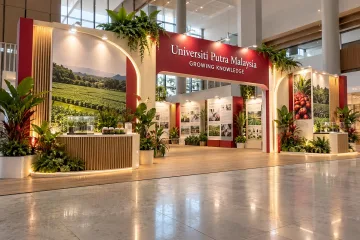 Universiti Putra Malaysia agriculture and innovation exhibition with a botanical university exhibition entrance arch, plant demonstration counter and agricultural research display panels