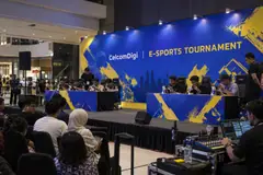 CelcomDigi e-sports tournament design reference with mobile-tournament preparation stage and audience area