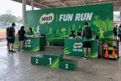 MILO fun run design reference with fun-run registration and medals corner