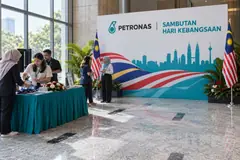 PETRONAS hari kebangsaan design reference with corporate national-day welcome and photo wall