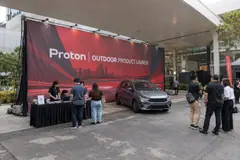 Proton outdoor product launch design reference with covered outdoor passenger-car launch wall
