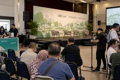 IJM Land public town hall design reference with resident public-dialogue stage and audience microphone