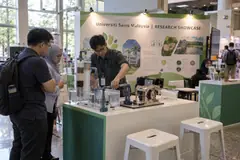 Universiti Sains Malaysia research showcase design reference with hands-on research demonstration island and project wall